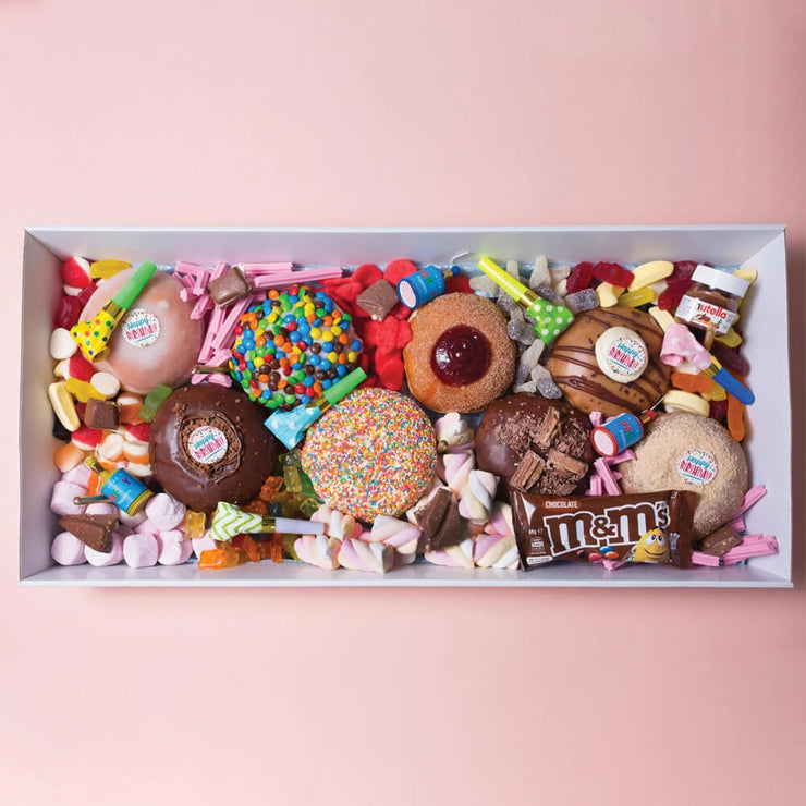 Party box filled with doughnuts, lollies, marshmallows and more